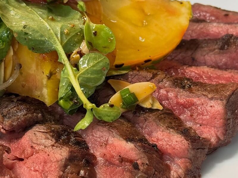 Seven spice grilled flank steak with heirloom tomato salad