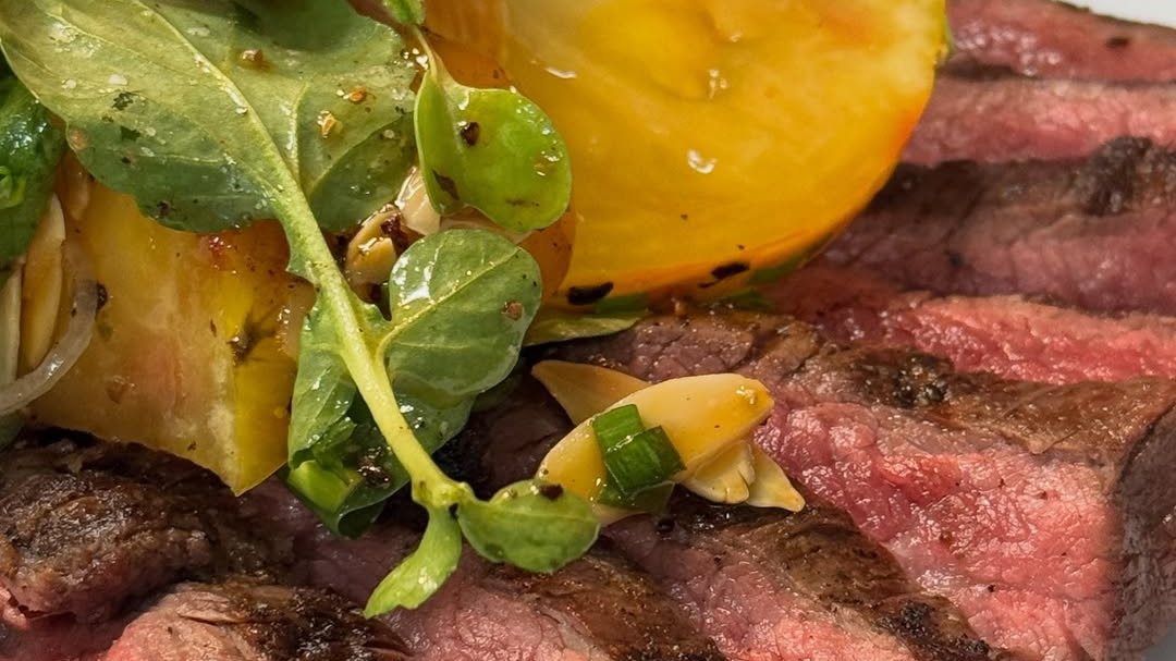 Seven spice grilled flank steak with heirloom tomato salad at No Ordinary Rabbit